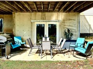 a group of chairs and a table on a patio at 2 Bdrm Country Sanctuary in SW Michigan in Benton Harbor