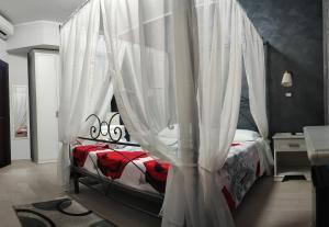 Postel nebo postele na pokoji v ubytování Guest House Elettra