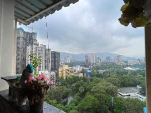 a view of a city from a balcony at Calm Private Room with Beautiful View in Mumbai