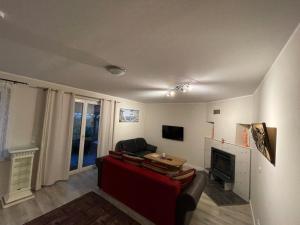 a living room with a couch and a fireplace at Ferienhaus- Dallgow in Dallgow