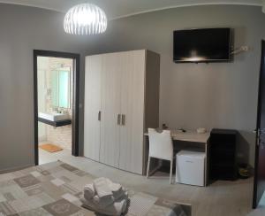 TV a/nebo společenská místnost v ubytování Guest House Elettra