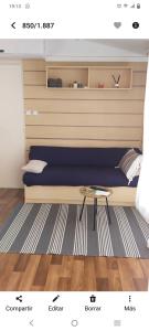 a bedroom with a bed with a table in it at Bungalow 5 pers in L'Escala