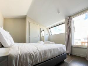 Giường trong phòng chung tại Aster ANhome Premium Selections