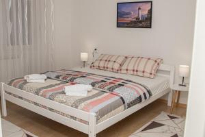 Ένα ή περισσότερα κρεβάτια σε δωμάτιο στο Apartment Forever