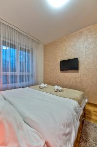 Krevet ili kreveti u jedinici u okviru objekta Royal Apartman