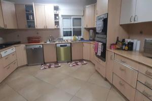 a kitchen with a floor that has been cleaned at Kosher 'Villa Rosa' Moshav Aderet, Ella Valley nr Bet Shemesh in Adderet