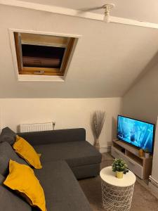 TV a/nebo společenská místnost v ubytování Le Cocon Douaisien
