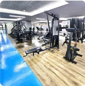 a gym with a swimming pool and several tread machines at Ap. Confortável e funcional. in Brasilia