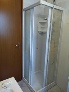 a shower with a glass door in a bathroom at Rifugio degli Dei in Monzuno