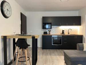 Kuchyň nebo kuchyňský kout v ubytování Appartement cosy à Nancy - Parking privé + 5 fotografií