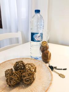a plate with rope on a table with a bottle of water at Boavista Beach Apartment in Sal Rei
