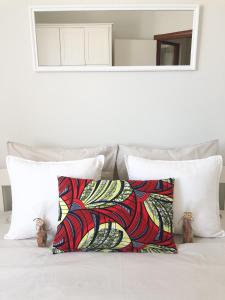 a pair of pillows sitting on a bed at Boavista Beach Apartment in Sal Rei