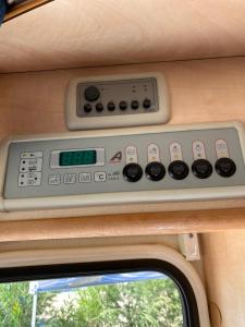 a control panel in the back of a train at Autocaravana Lisboa in Frielas
