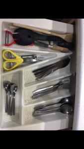 a drawer filled with lots of utensils at Autocaravana Lisboa in Frielas