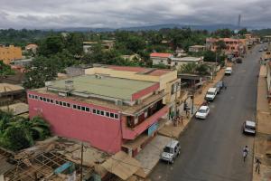 an overhead view of a city street with cars and buildings at Residencial Avenida Geovanni in São Tomé