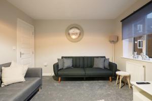 A seating area at Stradbroke House - 5-Bed Home, Sleeps 11, Great for Group Stays & Workers, FREE Parking & Netflix