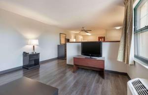 a large living room with a flat screen tv at Extended Stay America Select Suites - Lexington Park - Pax River in Lexington Park