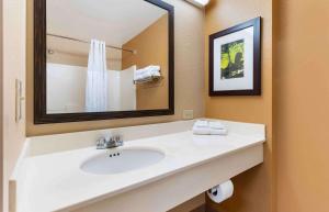 a bathroom with a sink and a mirror at Extended Stay America Suites - Sacramento - Vacaville in Vacaville