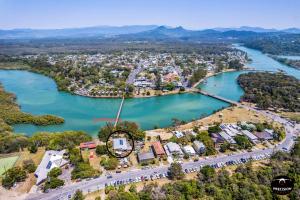 an aerial view of a town next to a body of water at Brunswick Riverfront Apartment - Absolute Riverfront in Brunswick Heads