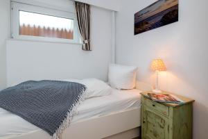 Ein Bett oder Betten in einem Zimmer der Unterkunft Sylt Liebt Dich 3