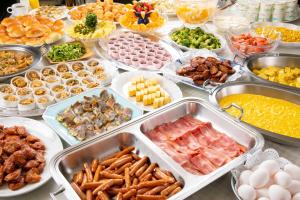 a buffet with many trays of different types of food at Main Hotel - Vacation STAY 82550 in Miyakonozyō