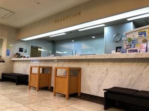 a reception area of a hospital with a reception counter at Main Hotel - Vacation STAY 82550 in Miyakonozyō