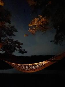 a hammock at night with a view of the sky at Island Tent Overlook in Maine in Monmouth