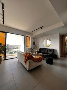 Posezení v ubytování Lujoso apartamento central, nuevo y cómodo