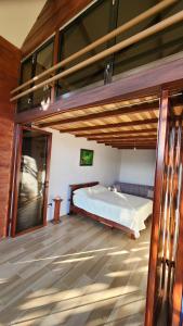 a bedroom with a bunk bed in a house at Cabañas Vista de Oro in Paraíso