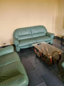 Ein Sitzbereich in der Unterkunft As résidence meublée