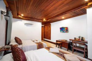 Postel nebo postele na pokoji v ubytování P5 Angkor Residence
