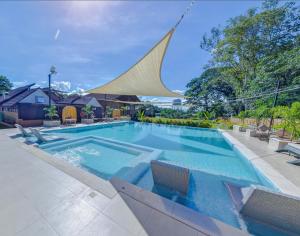 The swimming pool at or close to Hacienda Angelita Nature Farm and Resort