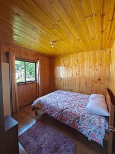 Postel nebo postele na pokoji v ubytování Cabaña Queule Costero