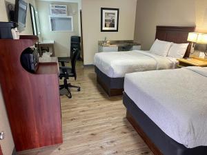 Ein Bett oder Betten in einem Zimmer der Unterkunft Wapiti Lodge