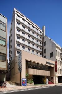 a large building on a city street at Okayama View Hotel in Okayama