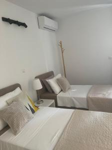 Postel nebo postele na pokoji v ubytování Villa Dijana