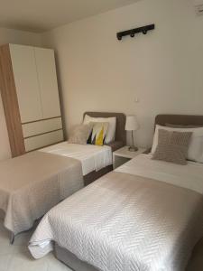 Postel nebo postele na pokoji v ubytování Villa Dijana