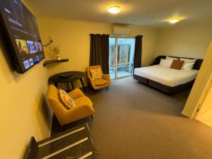 Säng eller sängar i ett rum på B-Ks Premier Motel Palmerston North