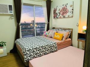 The Elevated Abode - ComfyCosy 1-br at The Loop 객실 침대