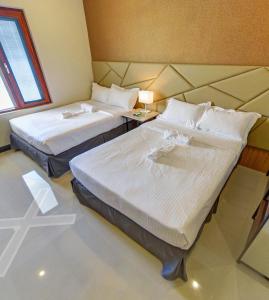 Ένα ή περισσότερα κρεβάτια σε δωμάτιο στο Hacienda Angelita Nature Farm and Resort
