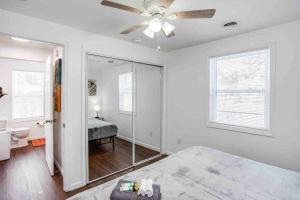 a bedroom with a bed and a ceiling fan at Tiny Home w/ King Bed mins DTWN in Rochester