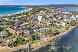 an aerial view of a resort on the beach at Admirals Lodge in Merimbula