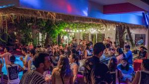 a crowd of people sitting in a room at Lushy Hostel Canggu in Canggu +72 photos