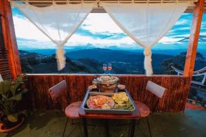 a tray of food on a table with a view at ไร่ดอยช้าง ม่อนเเจ่ม in Mon Jam