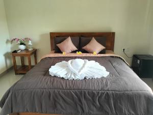 Postel nebo postele na pokoji v ubytování Danas Pandawa Homestay