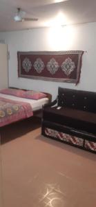 Zimmer mit 2 Betten in einem Zimmer in der Unterkunft Monsoon in Agonda
