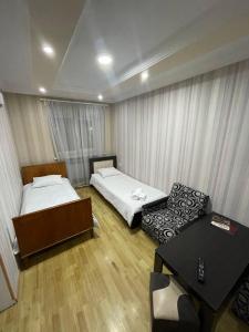 En eller flere senger på et rom på Olympic Hotel