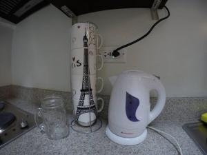 a kitchen counter with a coffee maker and a blender at Staycation in the South (Near Manila Airport) in Manila