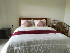 Postel nebo postele na pokoji v ubytování Danas Pandawa Homestay