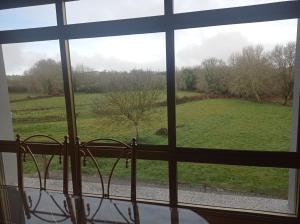 a view of a field from a window at Ribeira Sacra 2 O Saviñao in Villasante